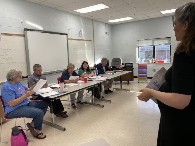 (Alex Bavosa/The Oglethorpe Echo) Jennifer Yauck (right), an Oglethorpe County High School teacher, updates the Board of Education on the status of the Dolly Parton Imagination Library, a program that provides children with free books.