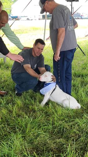 A dog receives a blessing at the inaugural Blessing of the Pets, a fundraising event held by the Winterville Animal Clinic last month. The event raised $1,300 for the clinic's Angel Fund, designed to help animals in need. (SUBMITTED PHOTO)