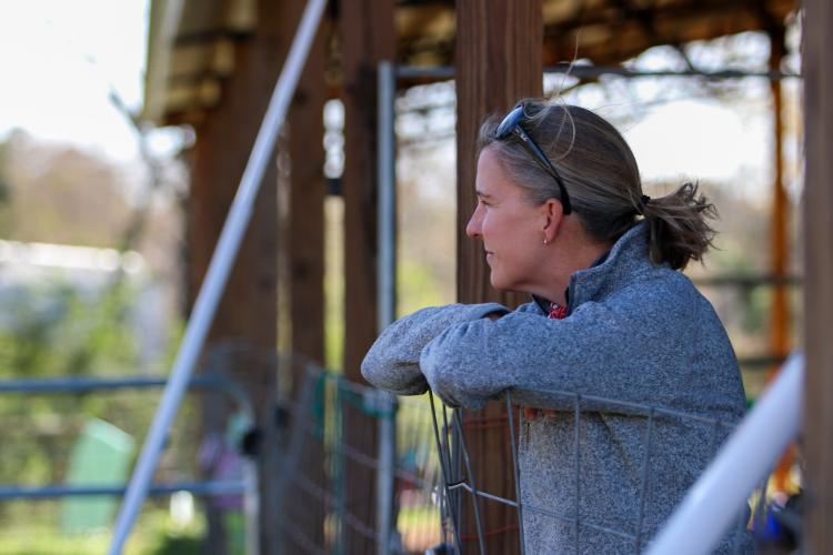 Paulette Brown, owner of Redux Equine rescue, watches Cathy Micali and Meg Eades train horses. (Photo/Aisha Schulz)