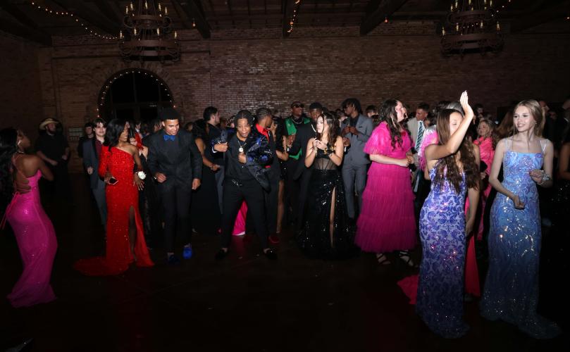 Oglethorpe County High School students and their dates dance to the “Cha Cha Slide” by DJ Casper. (LANDEN TODD/THE OGLETHORPE ECHO)
