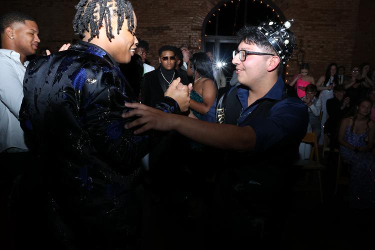 Juan Delgado, wearing his crown as prom king, celebrates with other students. (LANDEN TODD/THE OGLETHORPE ECHO)