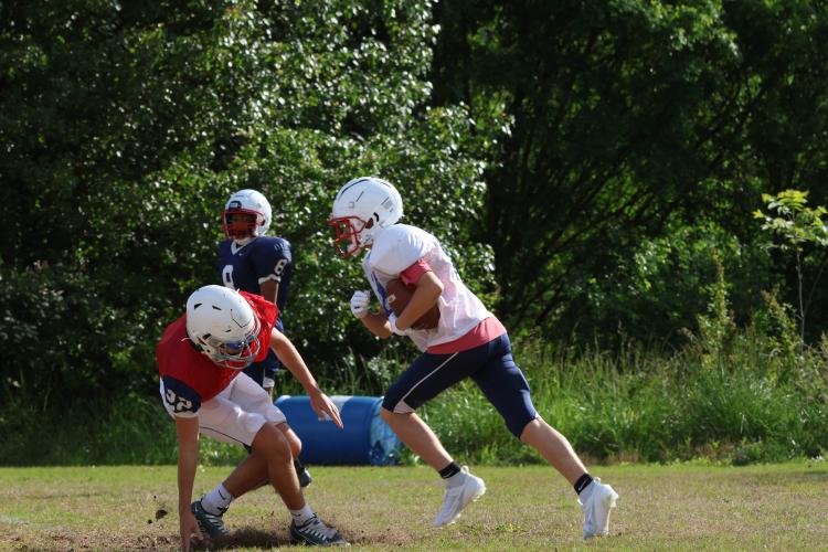 Landon Fields (18) runs toward Dalton Hilley (22) at spring practice last week. The Patriots were 5-6 last year and lost in the first round of the Class A Division I playoffs. (LANDEN TODD/THE OGLETHORPE ECHO)