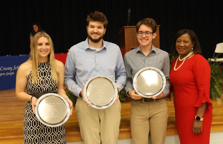 Oglethorpe County High School honorarian Claire Gabriel (from left), valedictorian Charles Brewer and salutatorian Aidan Abrams, pictured with OCHS principal Susie Johnson, were named at the Class of 2023 Senior Honors Night at the cafeteria on Tuesday. (LANDEN TODD/THE OGLETHORPE ECHO)