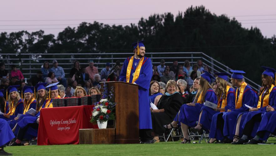 Oglethorpe County High School valedictorian Charles Brewer gives a speech called "Is This the Real Life?" during the graduation ceremony at Patriot Stadium last Friday night. The ceremony was originally scheduled for Saturday morning, but was moved up to take advantage of better weather. (LANDEN TODD/THE OGLETHORPE ECHO)