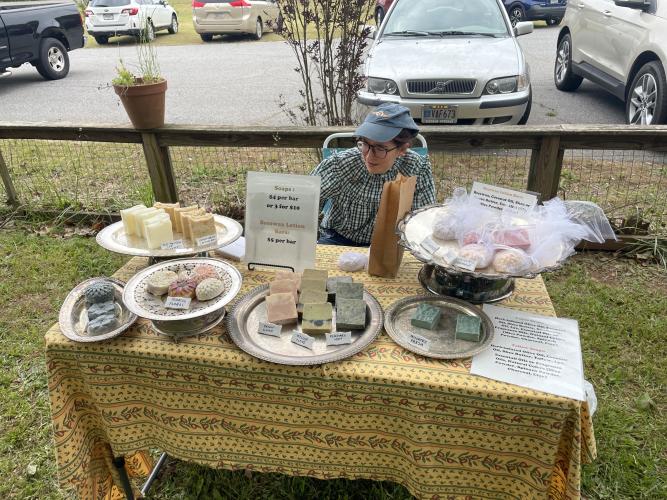 Emily Thomas recently began soap making as a hobby and set up a table at the second annual Art Bazaar and Book Sale, which was held on Saturday at No. 3 Railroad Street in Arnoldsville. "Peggy (Hroma) convinced me to come out here and sell my soap and it has been really successful so far." (RAMON ELORTONDO/THE OGLETHORPE ECHO)