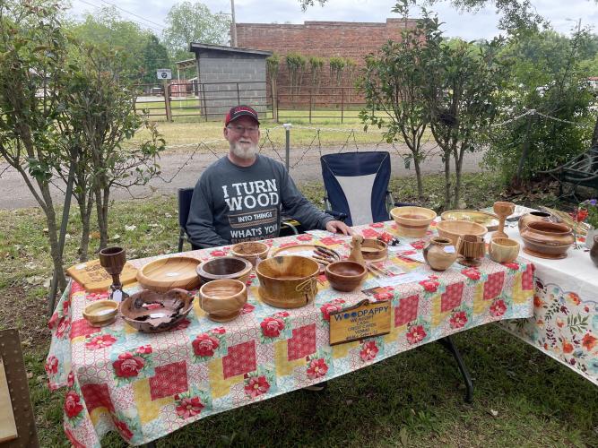 Mike Sellers is a talented craftsman that turns wood to create bowls, wine toppers and pens. He also does wood burning designs that were available at Saturday’s second annual Art Bazaar and Book Sale and are also for sale at the Rowdy Rooster. (RAMON ELORTONDO/THE OGLETHORPE ECHO)