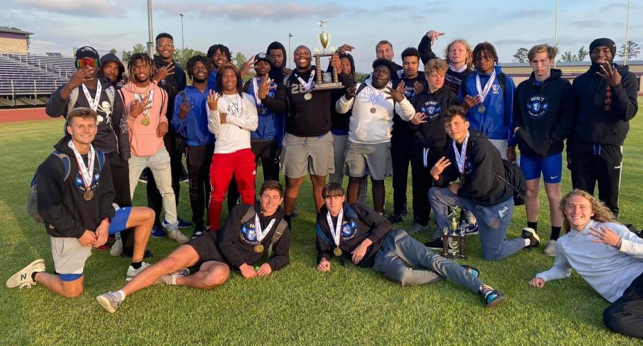 The OCHS boys track team shows off the trophy it won for capturing the Region 5-A Division I title last week. The team won two consecutive Region 4-AA titles before being reclassified to Class A Division I this year and winning another one this spring. (SUBMITTED PHOTO)