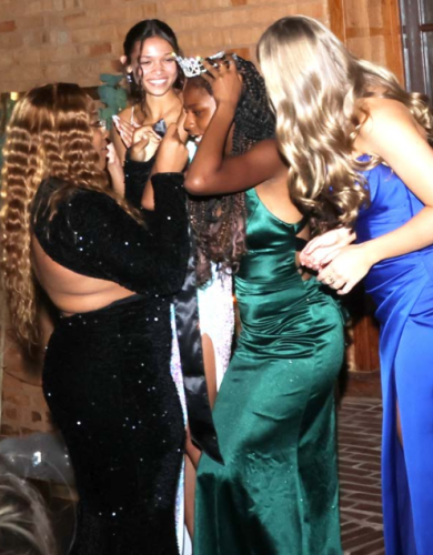 Senior Nadia Henderson tries on her crown after being selected as prom queen. (LANDEN TODD/THE OGLETHORPE ECHO)