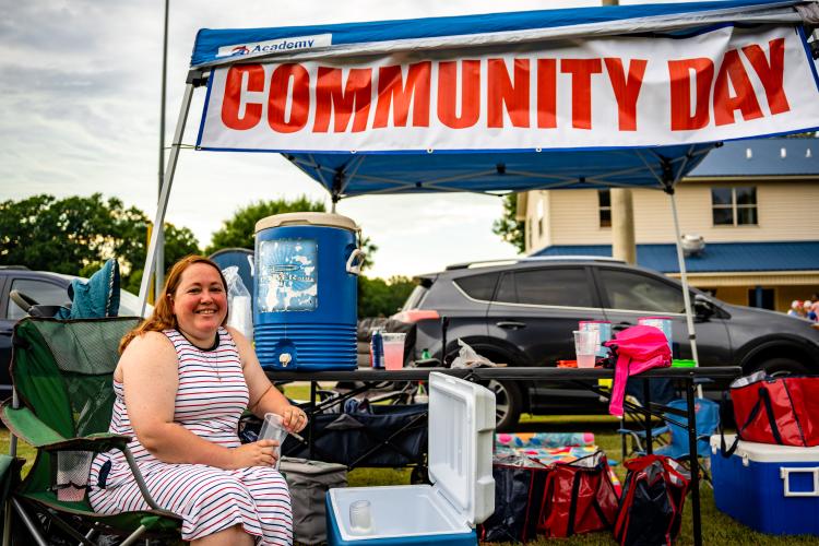 Jeanne Jones staffs the Community Day tent during last year’s Fourth of July celebration at Bryan Park. Community Day is held just before the start of the school year to give supplies to students and help prepare them for the school year. (JACK CASEY/THE OGLETHORPE ECHO)