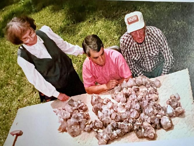 Cristina Harris (from left), John Koontz and Frank Harris look at the Muscadines as they appeared in 1994, before they were displayed at the Oglethorpe County Library. Koontz was part of the first dig and Frank Harris found the site. (SUBMITTED PHOTO)