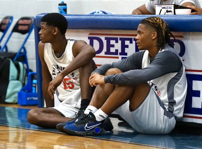 Ty Burgess (left) and Jordan Johnson wait during a break in the action to check into a summer league game. Johnson has displayed “defensive intensity and effort,” OCHS coach Larry Brown said. (SUBMITTED PHOTO)