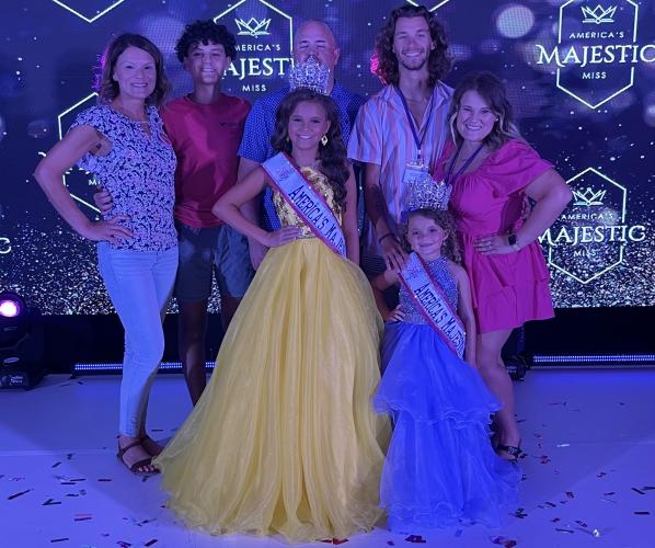 Pageants are a family affair for the Raines family. The support for Madalyn (front left)), who is 11 years old, and Isabella (front right), who is 5, includes (from left) Brandy, Grayson and Chris (Madalyn’s mom, brother and dad), and Ian and Megan (Isabella’s mom and dad). (SUBMITTED PHOTO)
