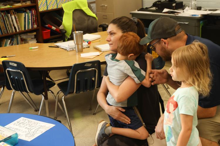 Kaylan and Adam Carter comfort their son Cohen on the first day of kindergarten as daughter Charlotte looks on at Oglethorpe County Primary School on Monday. (LANDEN TODD/THE OGLETHORPE ECHO)