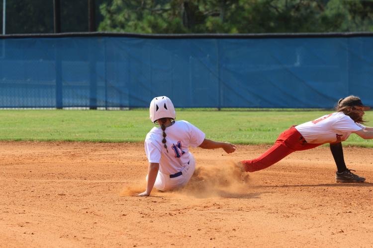 Sophomore Carolyn Barner slides into second base in the loss to Lincoln County. She had two hits in a 13-1 victory over Putnam County in the second game on Saturday. (LANDEN TODD/THE OGLETHORPE ECHO)
