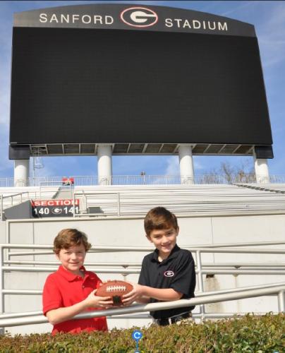 Thanks to the ingenuity of the great-grandfathers of Lamartine Griffin (Lam) Hardman V, left, and Henri Leon (Beau) Farmer IV, the Georgia Bulldogs have played between the hedges in Sanford Stadium since 1929. Today, Lam Hardman, left, is a senior at Athens Academy, thinking about UGA. Beau, right, is a junior, studying accounting, at Georgia College and State University in Milledgeville. (SUBMITTED PHOTO)