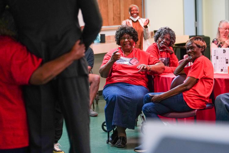 Red players Grace Hunter, Annie Armstrong and Bonnie Patterson laugh during their team's turn on Friday morning, Sept. 15, 2023. NBA All Star Dwight Howard hosted 'Family Feud' at the Oglethorpe Senior Center in Crawford, Georgia. (Photo/Sidney Chansamone)