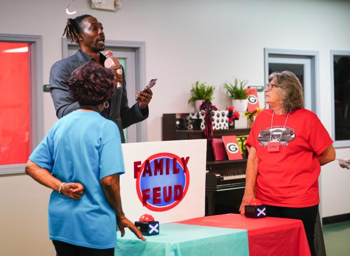 Red team player Linda Fowler faces blue team player Roz Echols on Friday morning, Sept. 15, 2023. NBA All Star Dwight Howard hosted 'Family Feud' at the Oglethorpe Senior Center in Crawford, Georgia. (Photo/Sidney Chansamone)
