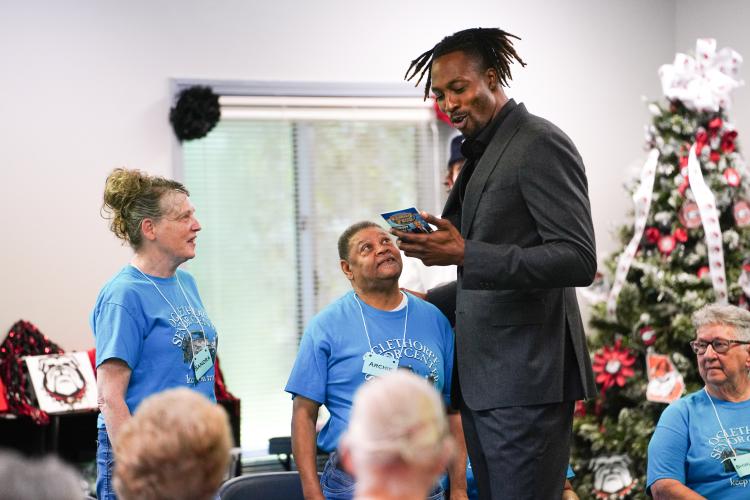 Sandra Wineinger and Archie Huff answer questions from NBA All Star Dwight Howard on Friday morning, Sept. 15, 2023. Howard hosted 'Family Feud' at the Oglethorpe Senior Center in Crawford, Georgia. (Photo/Sidney Chansamone)