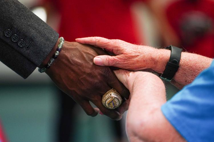 NBA All Star Dwight Howard lends a hand to Willodean Wright on Friday morning, Sept. 15, 2023. Howard hosted 'Family Feud' at the Oglethorpe Senior Center in Crawford, Georgia. (Photo/Sidney Chansamone)