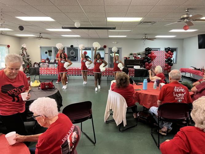(Tyler Blount/The Oglethorpe Echo) xUGA cheerleaders led the cheers as part of Calling the Dawgs at a tailgate event at the Oglethorpe  County Senior Center on Sept. 1, in advance of the Bulldogs’ first game last weekend. The event also  featured music and food