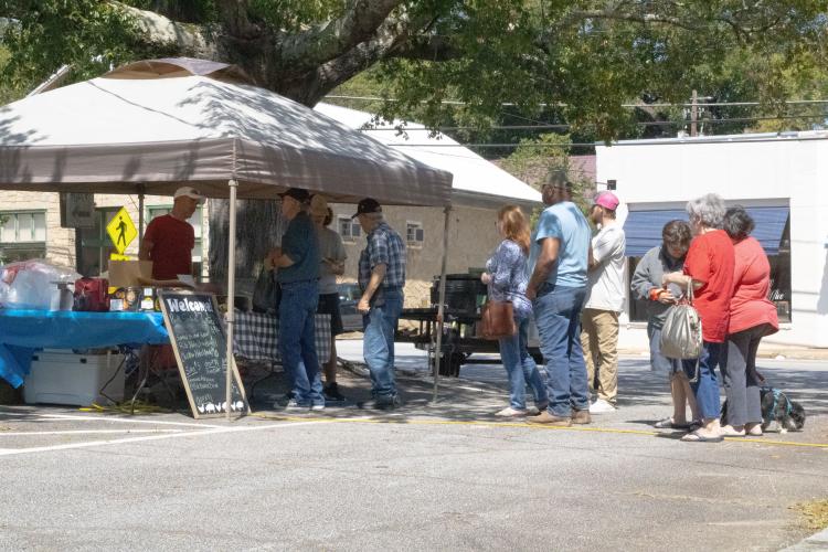 Folks line up for 2nd Chance BBQ at LexFest, where Mark Atkins and his son, Trace, sold pulled pork sandwiches, ribs and chicken on Saturday. (Photo/Elena Acosta)