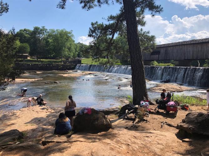 Folks enjoy the South Fork of the Broad River, which flows through Watson Mill Bridge State Park. County officials are in support of a more stringent water quality for that part of the river.