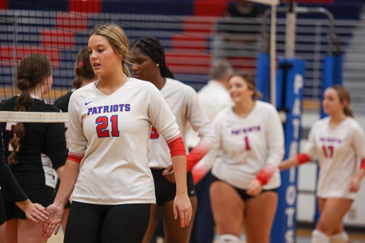Sophomore Elizabeth Cook high fives the Rabun County volleyball team before Oglethorpe County High School volleyball's first-round state playoff victory on Wednesday, Oct. 18, 2023, in Lexington, Georgia. (Photo/Cassidy Hettesheimer)