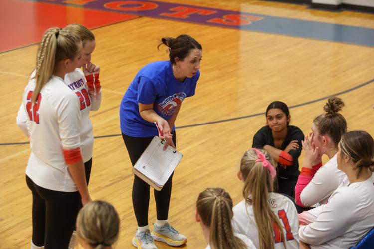 Oglethorpe County volleyball coach Brianne Harrison talks to the team between sets during Oglethorpe's first-round state playoff win over Rabun County on Wednesday, Oct. 18, 2023, in Lexington, Georgia (Photo/Cassidy Hettesheimer).