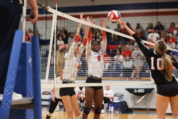Senior Avery Kort and junior Kenzie Henderson jump for a block during Oglethorpe County's first-round state playoff win over Rabun County on Wednesday, Oct. 18, 2023, in Lexington, Georgia (Photo/Cassidy Hettesheimer).