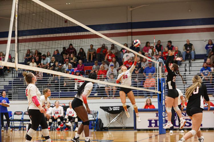 Senior Madi Kelley leaps to tap the ball over the net during Oglethorpe County's first-round state playoff win over Rabun County on Wednesday, Oct. 18, 2023, in Lexington, Georgia (Photo/Cassidy Hettesheimer).