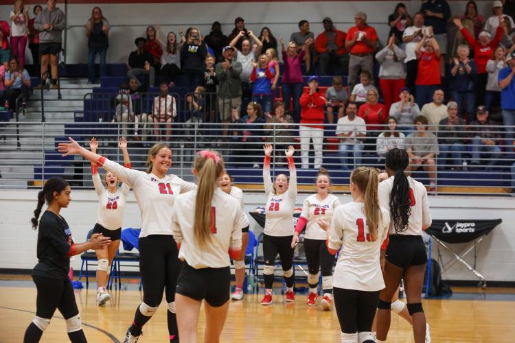 The Oglethorpe County volleyball team celebrates after the final point of its first-round state playoff win over Rabun County on Wednesday, Oct. 18, 2023, in Lexington, Georgia (Photo/Cassidy Hettesheimer).