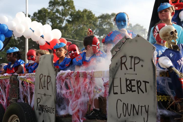 Members of Oglethorpe County rec department football teams get into the Halloween spirit with masks and tombstones on their OCHS homecoming float. (Photo/Cassidy Hettesheimer)