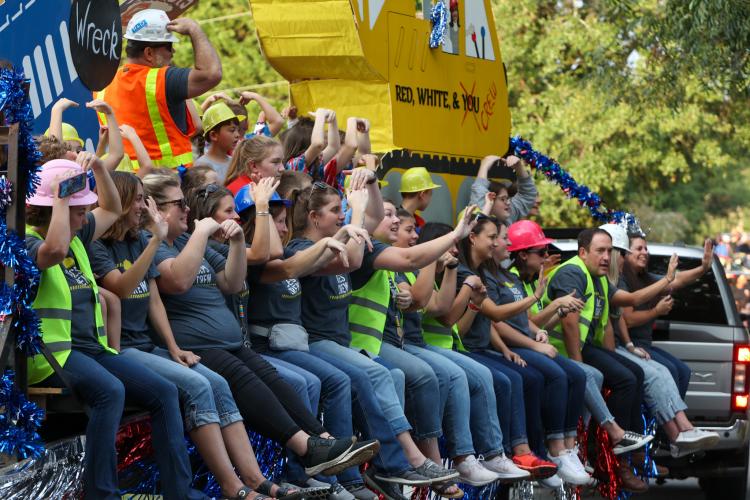 The joint float between Oglethorpe County Primary and Elementary Schools performs YMCA on their construction themed float, paying homage to the current construction of the new K-5 school building. (Photo/Cassidy Hettesheimer)