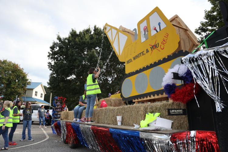 Oglethorpe County Primary School and Elementary School teachers prepare their float before the homecoming parade in Crawford, Georgia, on Thursday, Sept. 21, 2023. The primary and elementary schools' float theme involved the construction toward building the new joint K-5 school. (Photo/Cassidy Hettesheimer)