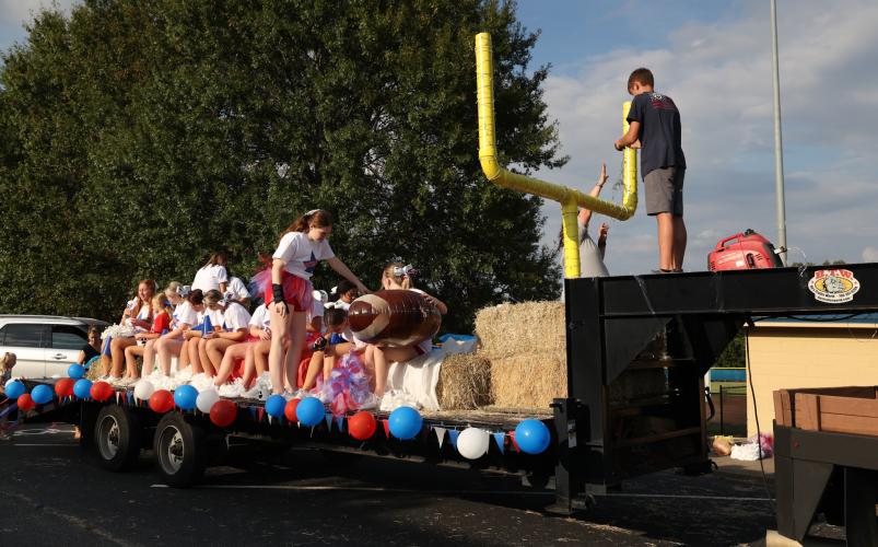 The Oglethorpe County High School cheerleading team prepares its float for the OCHS homecoming parade in Crawford, Georgia, on Thursday, Sept. 21, 2023. (Photo/Cassidy Hettesheimer)