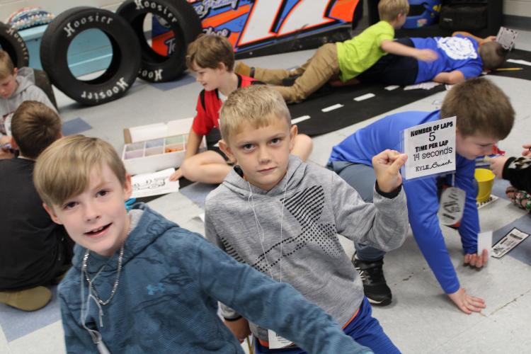 Monique Shelnutt’s third grade class enjoyed a race car themed classroom. Weston Puffenbarger (left) and Brantley Black completed worksheets while sitting along the racetrack and checkered flags. (Photo/Caleb Baldwin)