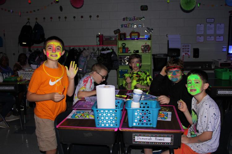 Katie Bailey’s fifth grade class were excited to have music and glow in the dark colors around the room. Many of the students were painted with glow in the dark face paint for the day. (Photo/Caleb Baldwin)