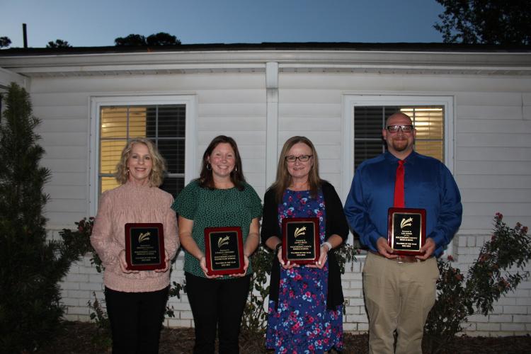 The 2023-2024 teachers of the year (left to right): Shonda Cronic, OCPS kindergarten; Lindsay Gregory, OCES gifted third-fifth grade teacher; Janet High, OCMS English teacher; Lee Jones, OCHS band director. (Photo/Caleb Baldwin)