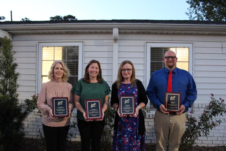 The 2023-2024 teachers of the year (from left): Shonda Cronic, OCPS kindergarten; Lindsay Gregory, OCES gifted third-fifth grade teacher; Janet High, OCMS English teacher; Lee Jones, OCHS band director.