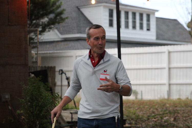 Joel Kriner who has lived in Arnoldsville for eight years, introduces himself to those gathered at the Arnoldsville community meet and greet. Kriner is running for city council in the Nov. 7 election. “I want to get to know you guys and hear what your concerns are and what you think the challenges are coming up over the coming years,” he said. (photo/ Elena Acosta)