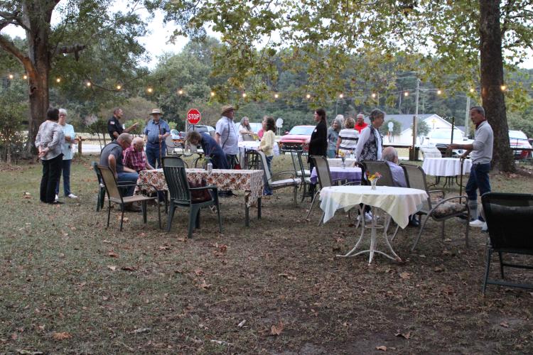 Several residents from Arnoldsville and the surrounding area gathered at No. 3 Railroad Street on Friday, Oct. 6. A handful of community leaders and city election candidates were in attendance. (photo/ Elena Acosta)