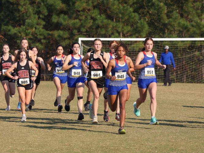 The Oglethorpe County girls cross country team begins the varsity girls 5K at the 1A Division 1 Region 5 cross country meet in Social Circle, Georgia, on Tuesday, Oct. 24, 2023. The Patriots finished second out of four teams in the varsity girls 5K. (Photo/Cassidy Hettesheimer)