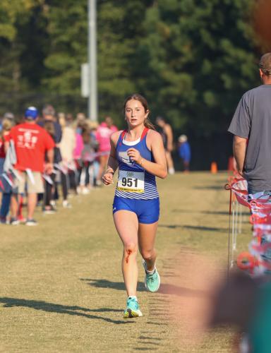 Oglethorpe County sophomore Elin Turner sprints toward the finish line in the varsity girls region 5K in Social Circle, Georgia, on Tuesday, Oct. 24, 2023. Henderson placed fourth overall in the varsity girls race with a time of 22:50. (Photo/Cassidy Hettesheimer)