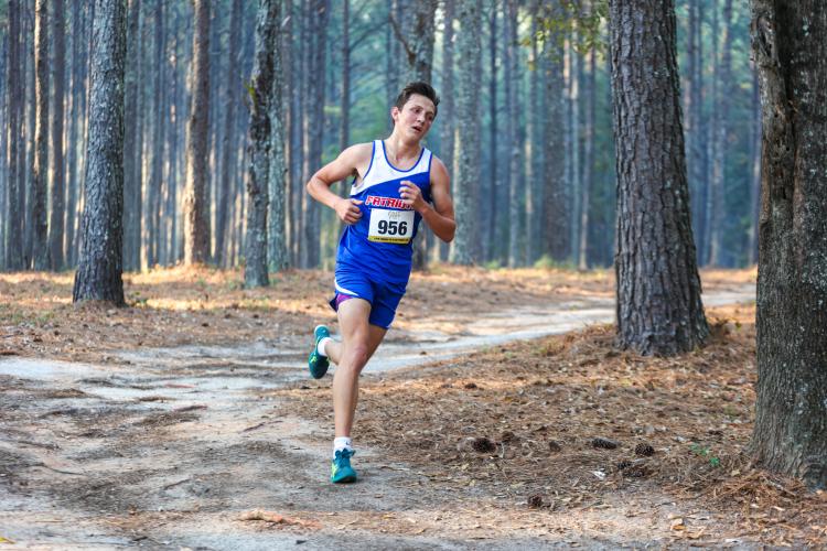 Senior Landon Mallonee runs his second lap of the 5K course at the 1A Division 1 Region 5 cross country meet in Social Circle, Georgia, on Tuesday, Oct. 24, 2023. With a time of 17:29, Mallonee finished second overall in the boys varsity 5K and first for the Oglethorpe County High School team. (Photo/Cassidy Hettesheimer)