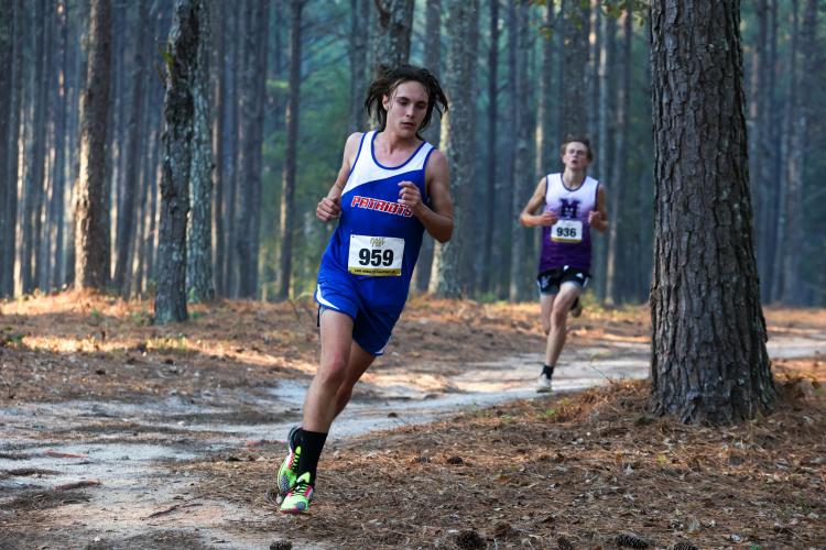 Oglethorpe County sophomore Dominic Piscitelli runs his second lap of the 5K course at the 1A Division 1 Region 5 cross country meet in Social Circle, Georgia, on Tuesday, Oct. 24, 2023. With a time of 18:48, Piscitelli finished fifth overall and second for the Patriots team. (Photo/Cassidy Hettesheimer)