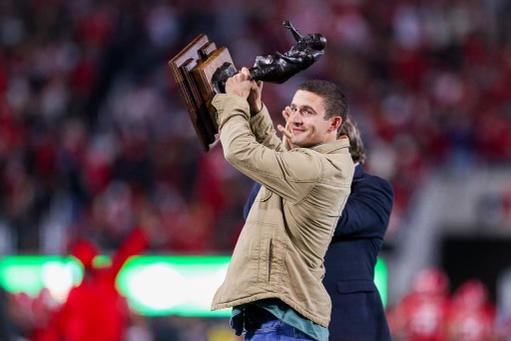 There was plenty to cheer about in Sanford Stadium on Saturday. One of the loudest roars was for No. 19 Brock Bowers, the All-America tight end, who returned from the injured list to score a touchdown. Another was for Stetson Bennett IV, above. The former Heisman Trophy finalist stepped onto the field to hoist the 2022 Burlsworth Trophy, which is awarded to the best college football player whose career began as a walk-on. (Tony Walsh/UGA Athletics)