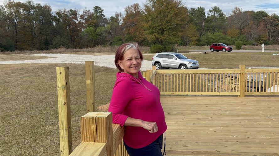 Amy Delfin-Torres now owns two businesses: Reflections Beauty Boutique in Crawford, and now, Town and Country Kafe. Behind Delfin-Torres is a small garden area where patrons can sit outside to enjoy their food and coffee. (Grace Mains/The Oglethorpe Echo)