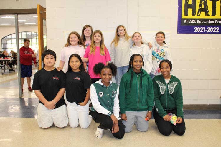 Sixth grade winners of the twin day raffle drawing (from left, back row) Haleigh York, Hadley Stone, Jenna Harvey, Breckyn Avery, Harley Owen, Lauren Major and (from left, front row) Calvin Hgay, Diana Valasquez, Br’niya Jackson, Nevaeh Terry and London Brunson pose together. (Photo/Caleb Baldwin)
