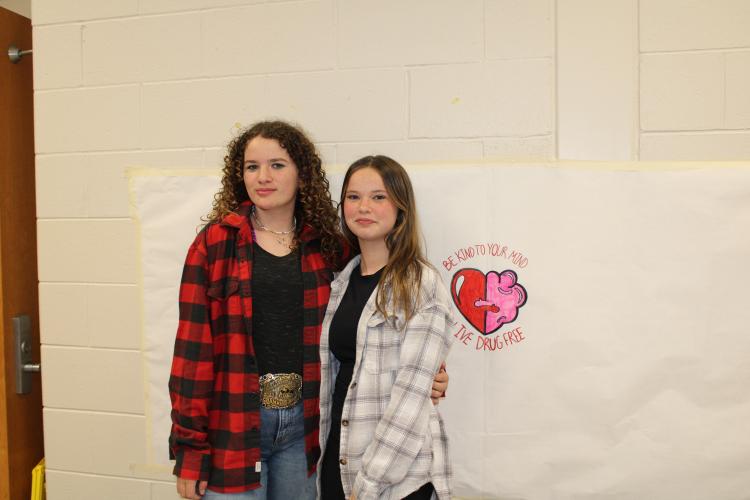 Eighth graders, Katherine Horsley and Lannah Scarborough pose in flannels for the days’ events. (Photo/Caleb Baldwin)