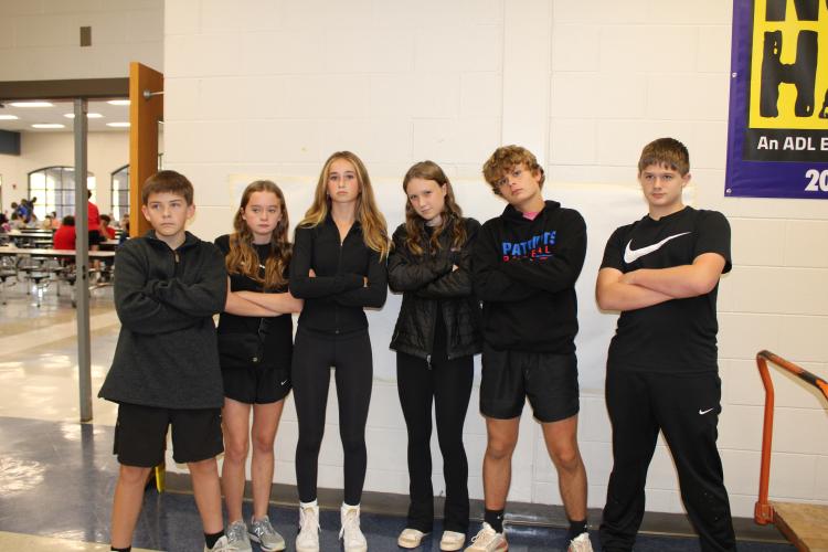 Eighth graders (from left), Lincoln Paradise, Kynlee Bohannon, Georgia Turner, Lyla Casper, Justin Wilson and Jack Baldwin posed together. The group matched in black outfits for the twin day theme. (Photo/Caleb Baldwin)
